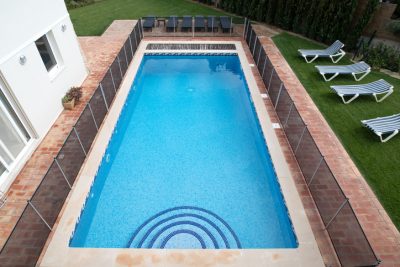 Pool fence around swimming pool.